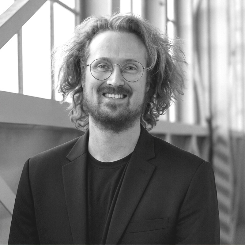 Black-and-white portrait of filmmaker Cray Novick.